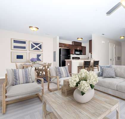A living room with a couch, chairs, and a coffee table.